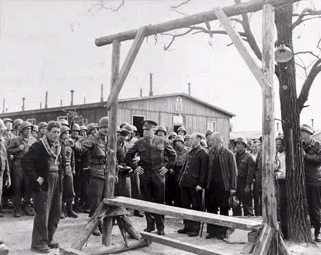 Captain Liethen and Gen. Eisenhower inspect camps note gallows