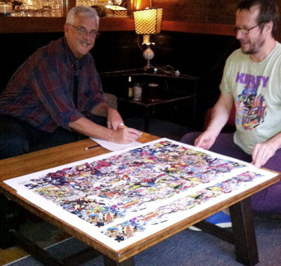 Tom Morehouse signing and numbering the new edition with help from Rand Hoppe. Photo by Chris Repella.